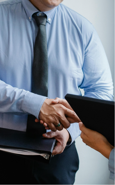 Education consultants completing a partnership agreement